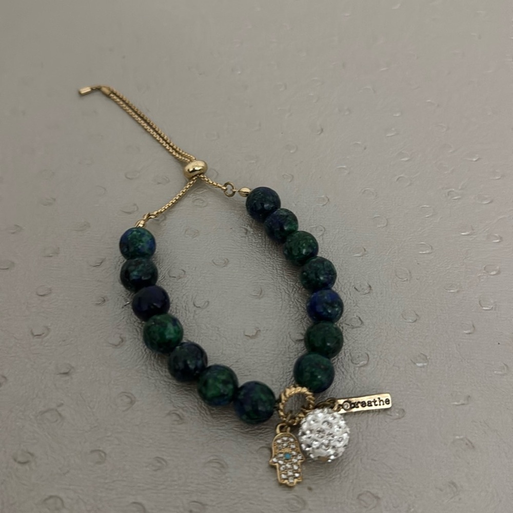 NWOT Adjustable bracelet with charms